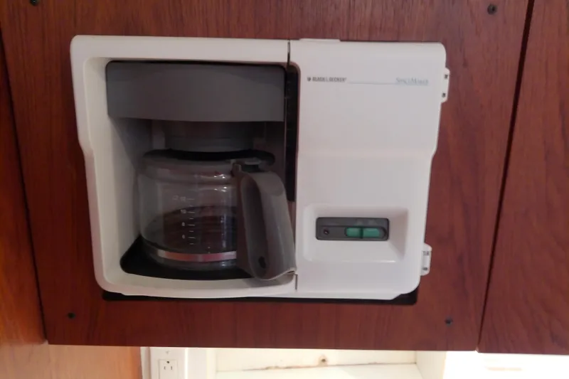 Slide: The Image of Built-in coffee maker on a 2000 Tiara Yachts 4100 Open, set in wooden cabinetry. - 54