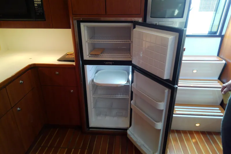 Slide: The Image of Open refrigerator in the galley of a 2000 Tiara Yachts 4100 Open. - 57