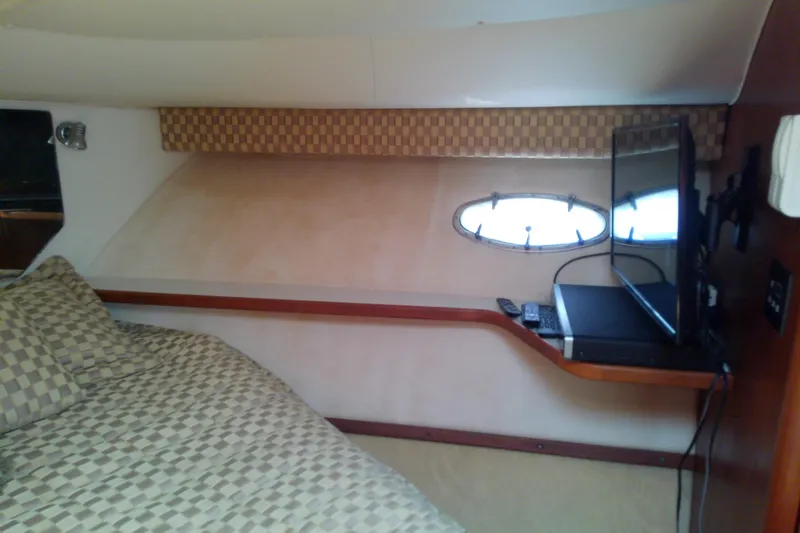 Slide: The Image of Interior cabin of 2000 Tiara Yachts 4100 Open with bed and TV. - 60
