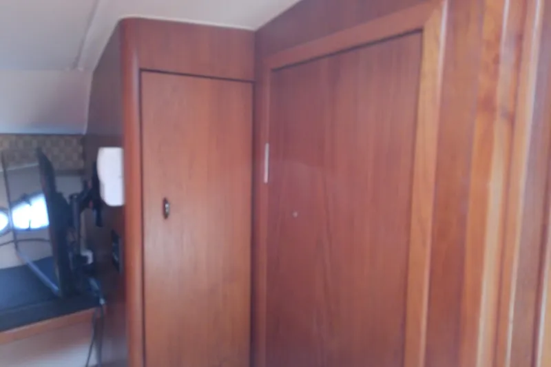 Slide: The Image of Interior view of 2000 Tiara Yachts 4100 Open with wooden cabinetry. - 63