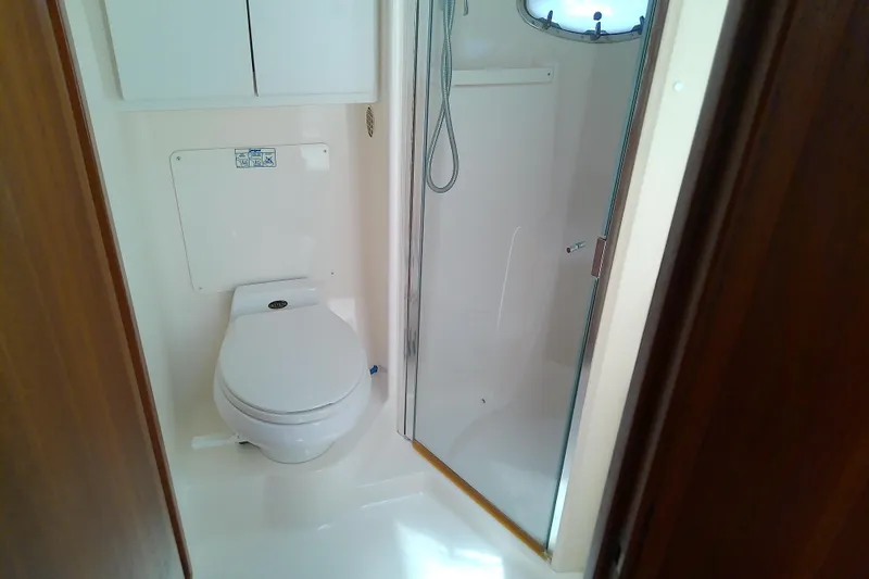 Slide: The Image of Bathroom interior of 2000 Tiara Yachts 4100 Open with toilet and shower. - 65