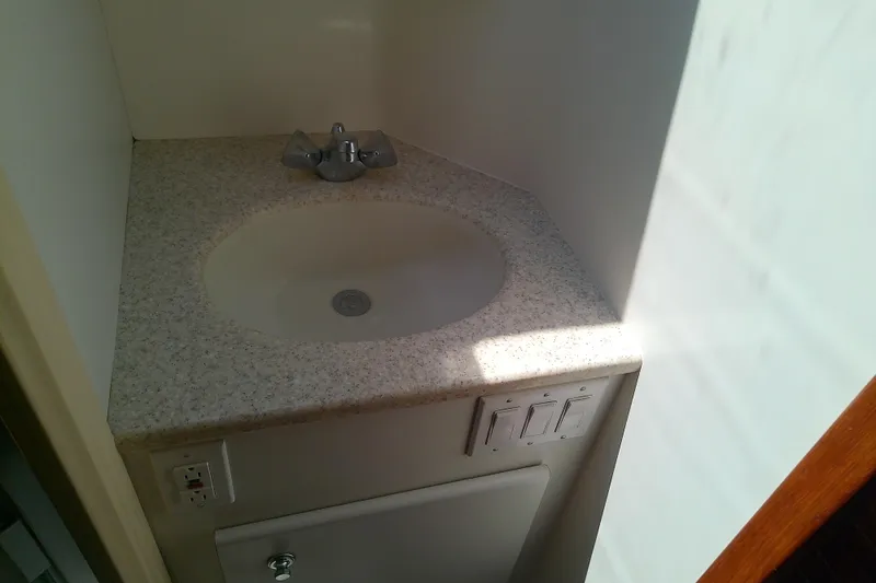 Slide: The Image of Compact bathroom sink in 2000 Tiara Yachts 4100 Open, featuring a modern countertop design. - 66