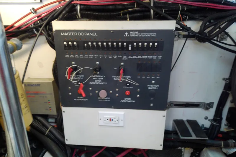 Slide: The Image of Master DC panel on a 2000 Tiara Yachts 4100 Open, featuring switches and wiring. - 73