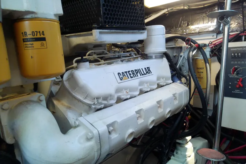 Slide: The Image of Engine room of 2000 Tiara Yachts 4100 Open featuring Caterpillar engine components. - 74
