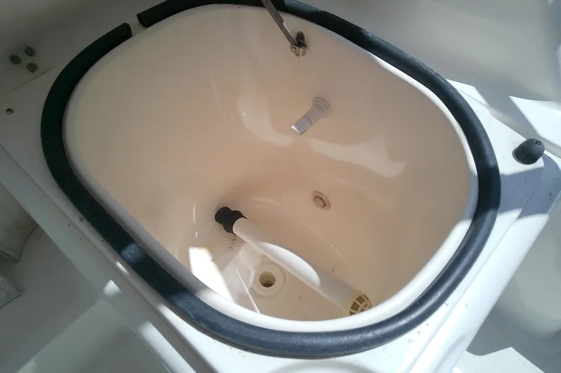Slide: The Image of Livewell on a 2000 Tiara Yachts 4100 Open boat, featuring a white interior. - 82