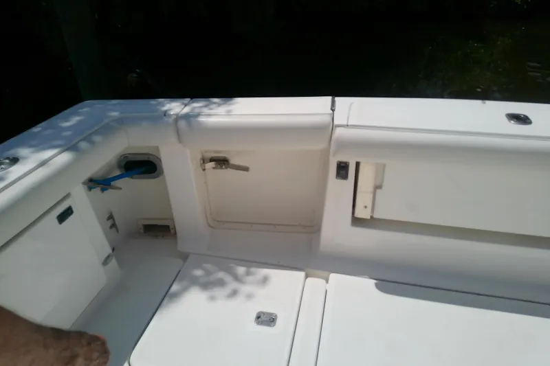 Slide: The Image of 2000 Tiara Yachts 4100 Open cockpit area with storage compartments and seating. - 83