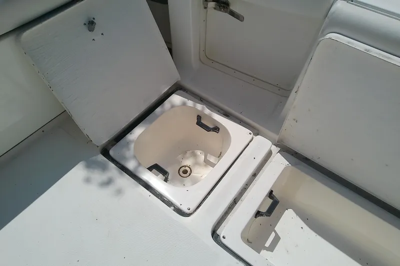Slide: The Image of Open storage compartments on a 2000 Tiara Yachts 4100 Open boat deck. - 85