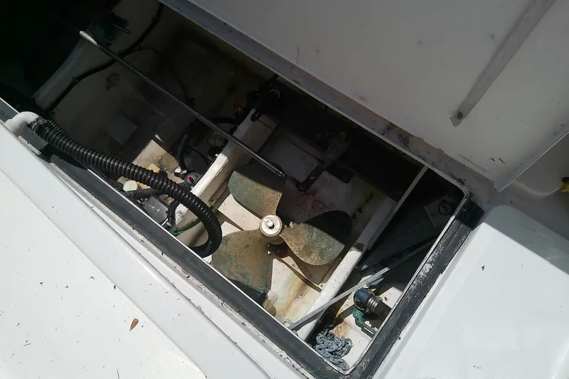 Slide: The Image of Engine compartment of a 2000 Tiara Yachts 4100 Open, showing mechanical components and wiring. - 86
