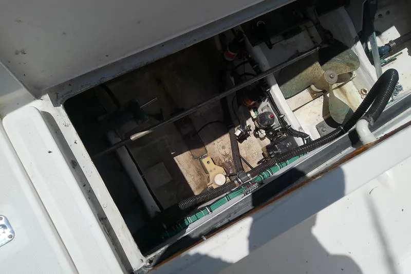 Slide: The Image of Engine compartment of a 2000 Tiara Yachts 4100 Open, showing mechanical components. - 87