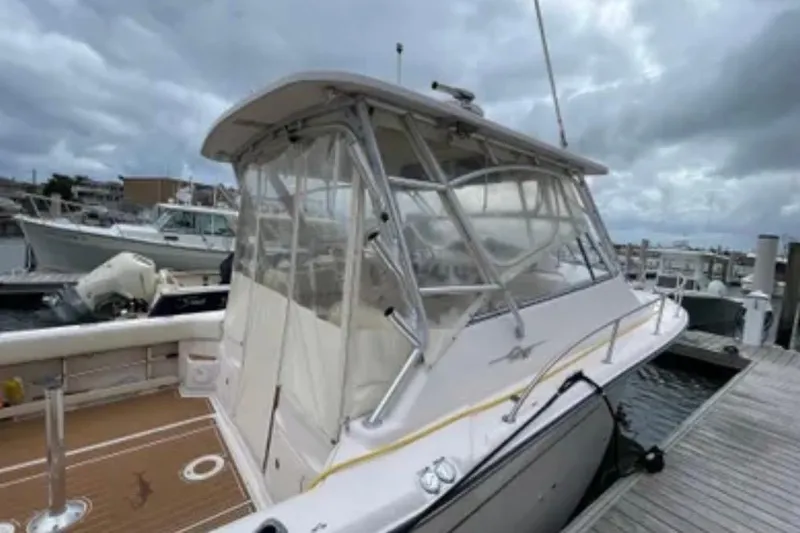 Slide: The Image of 2007 Grady-White Express 330 boat docked under cloudy skies. - 14