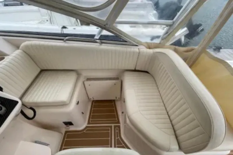 Slide: The Image of 2007 Grady-White Express 330 boat interior with beige seating and wood-patterned flooring. - 19