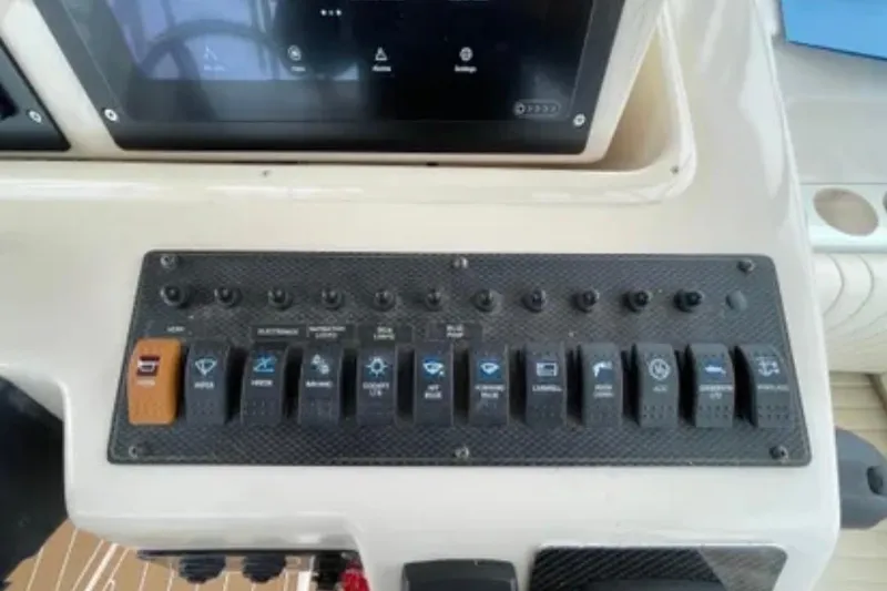 Slide: The Image of Control panel of a 2007 Grady-White Express 330 boat dashboard. - 22