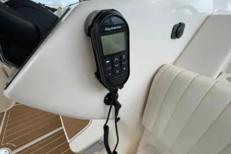 Slide: The Image of Raymarine device on 2007 Grady-White Express 330 boat, mounted near white seating. - 24