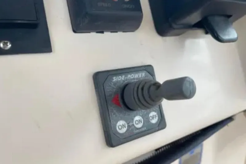 Slide: The Image of Control panel with joystick on a 2007 Grady-White Express 330 boat. - 25