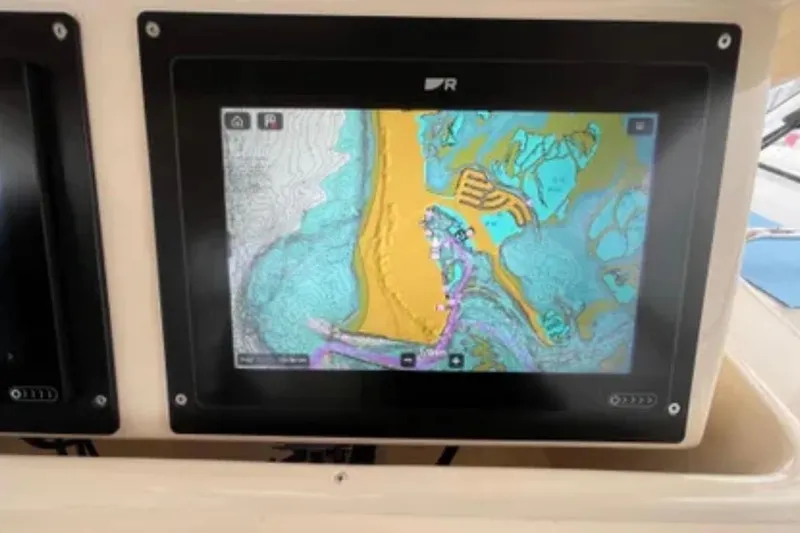 Slide: The Image of Navigation display on a 2007 Grady-White Express 330 boat showing a detailed marine map. - 29