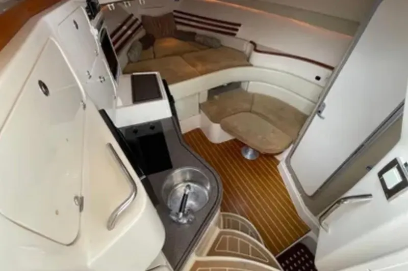 Slide: The Image of Interior of 2007 Grady-White Express 330 boat with seating and kitchenette. - 30
