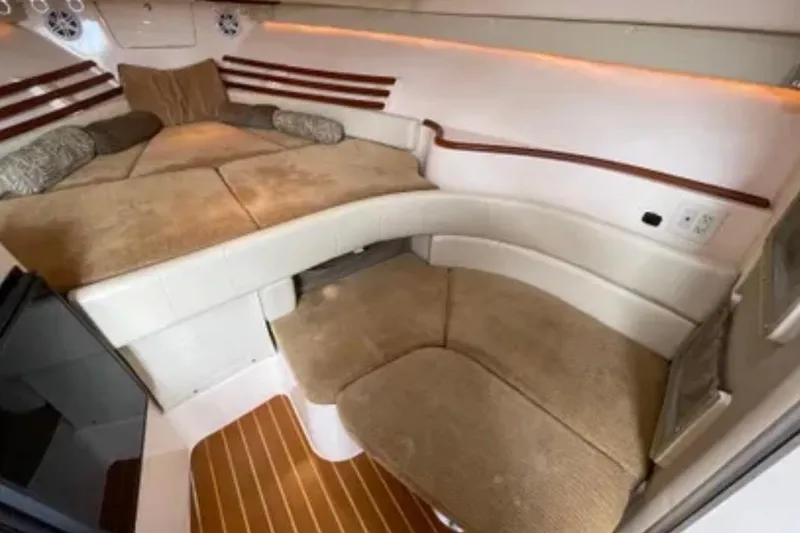 Slide: The Image of 2007 Grady-White Express 330 cabin interior with cozy seating and cushions. - 34