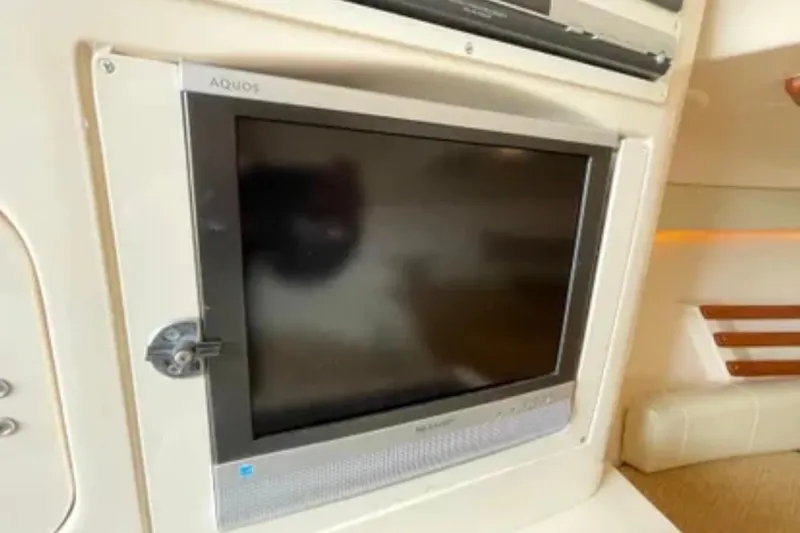 Slide: The Image of 2007 Grady-White Express 330 cabin with built-in Aquos TV display. - 39