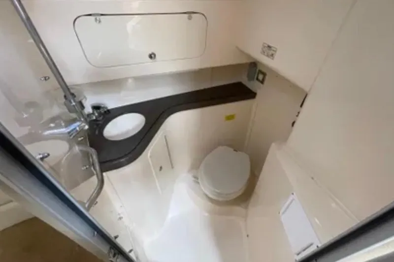 Slide: The Image of 2007 Grady-White Express 330 boat bathroom with compact design and modern fixtures. - 42