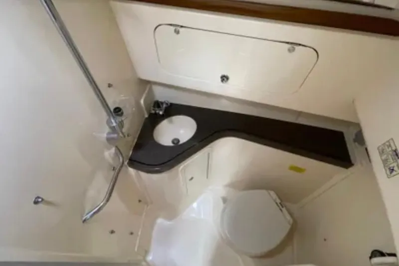 Slide: The Image of 2007 Grady-White Express 330 boat bathroom with sink, toilet, and shower. - 47