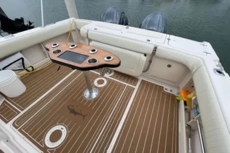 Slide: The Image of 2007 Grady-White Express 330 boat deck with seating and fishing rod holders. - 48