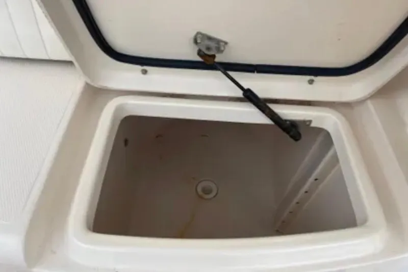 Slide: The Image of Open storage compartment on a 2007 Grady-White Express 330 boat. - 52