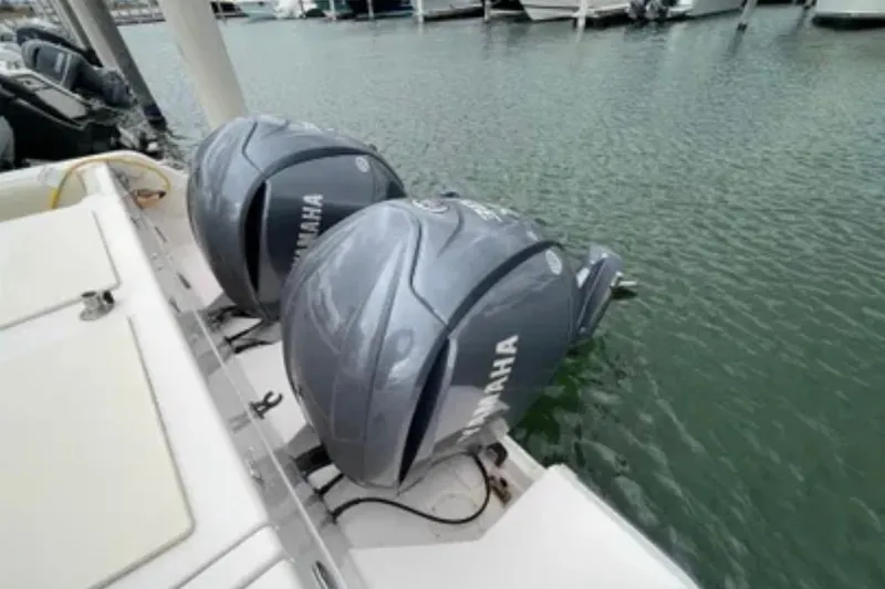 Slide: The Image of Twin Yamaha outboard engines on a 2007 Grady-White Express 330 boat docked in marina. - 54