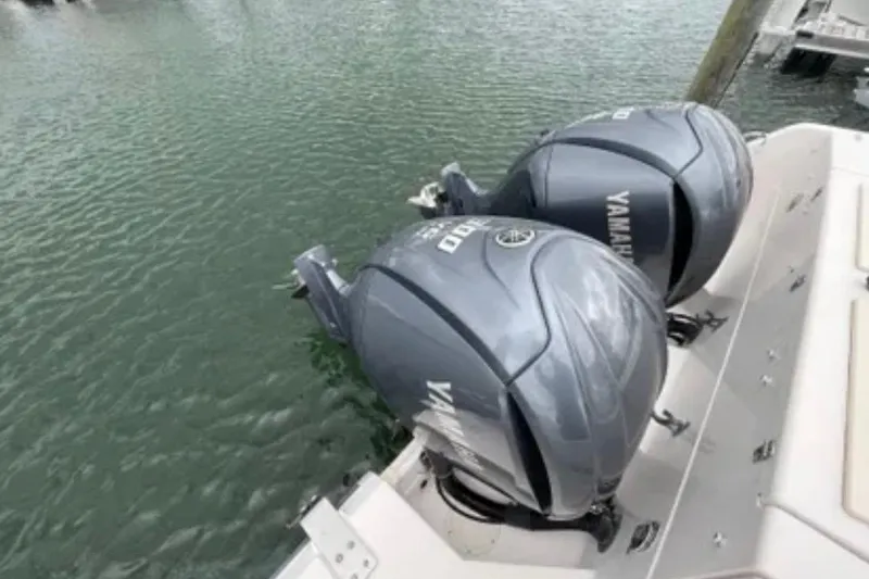 Slide: The Image of Twin Yamaha outboard engines on a 2007 Grady-White Express 330 boat. - 58