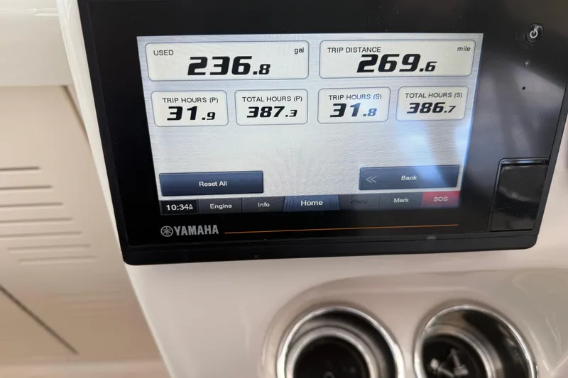 Slide: The Image of Yamaha display on 2021 Grady-White Express 330 showing fuel and trip data. - 12