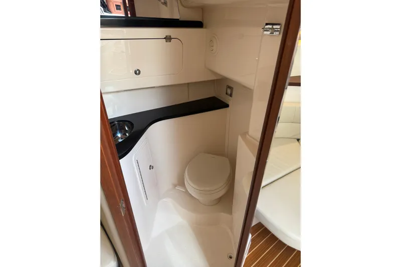 Slide: The Image of 2021 Grady-White Express 330 boat bathroom with modern fixtures and compact design. - 23