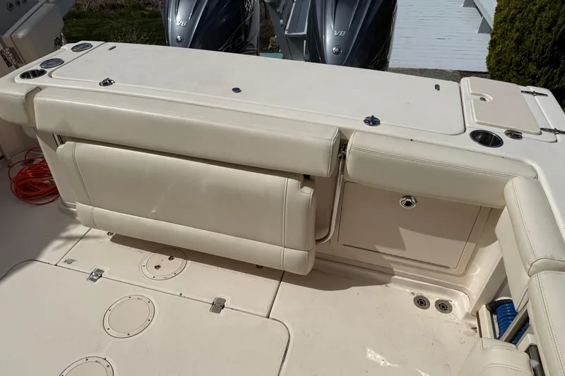 Slide: The Image of 2021 Grady-White Express 330 boat interior with seating and storage compartments. - 7