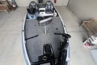 Slide: The Image of 2026 Ranger Z519R Cup-Equipped boat with dual motors in a garage setting. - 1