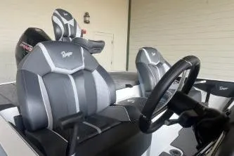 Slide: The Image of 2026 Ranger Z519R Cup-Equipped boat interior with sleek black and gray seating and steering wheel. - 8