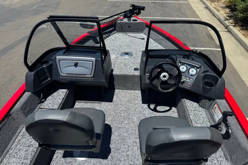 Slide: The Image of 2026 Tracker Pro Guide V-16 WT boat interior with dual seats and steering console. - 7