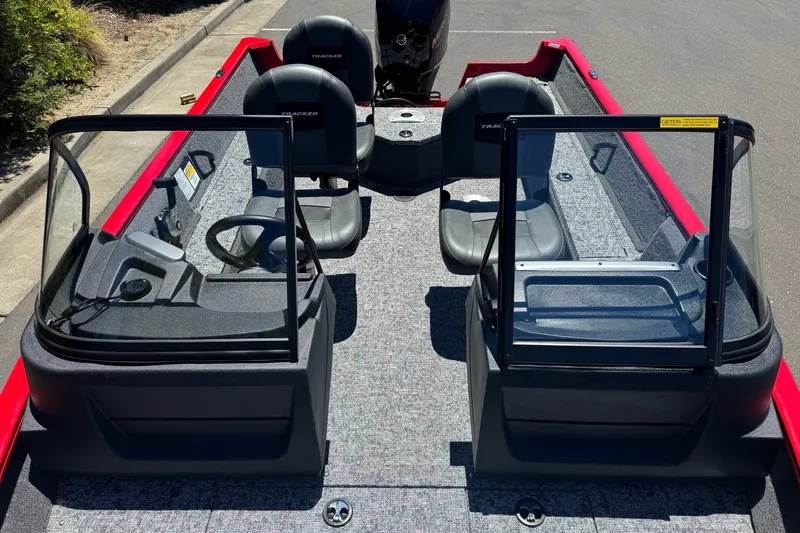 Slide: The Image of 2026 Tracker Pro Guide V-16 WT boat interior with dual consoles and seating. - 8
