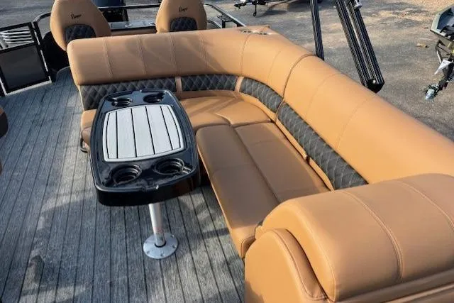 Slide: The Image of Luxurious seating area on 2026 Ranger 220F boat with tan upholstery and table. - 12