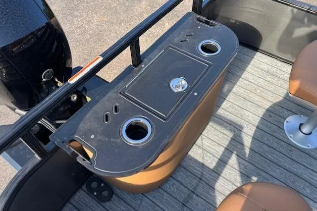 Slide: The Image of 2026 Ranger 220F boat interior with cup holders and seating on a wooden deck. - 15