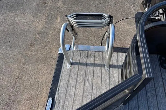 Slide: The Image of Ranger 220F 2026 boat ladder on deck, showcasing sturdy metal construction. - 16