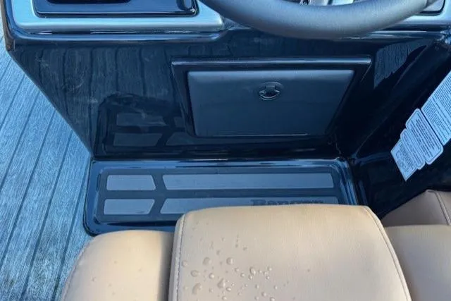 Slide: The Image of Interior view of a 2026 Ranger 220F boat dashboard with beige seating. - 20