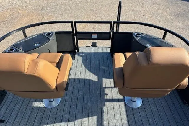 Slide: The Image of 2026 Ranger 220F boat interior with tan seats and cup holders on deck. - 23