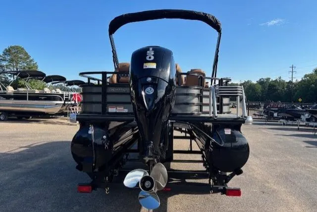 Slide: The Image of 2026 Ranger 220F boat with powerful outboard motor, parked in a marina under clear skies. - 5