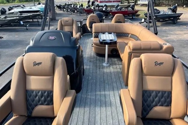 Slide: The Image of 2026 Ranger 220F boat interior with tan leather seating and modern design. - 9