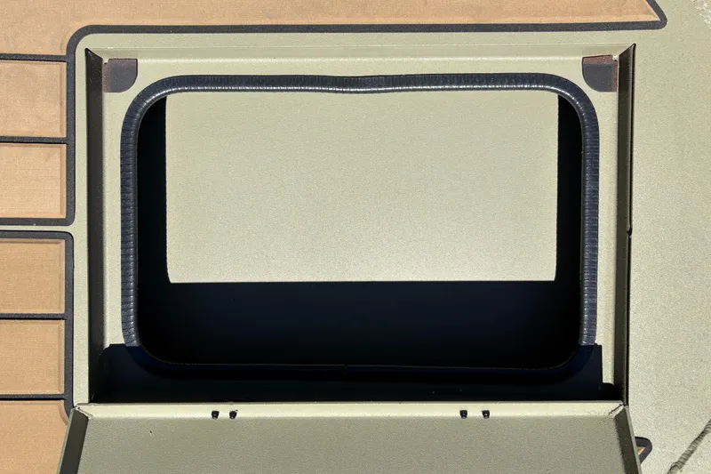 Slide: The Image of 2026 Tracker Grizzly 1756 T Marsh boat compartment, open hatch detail. - 8