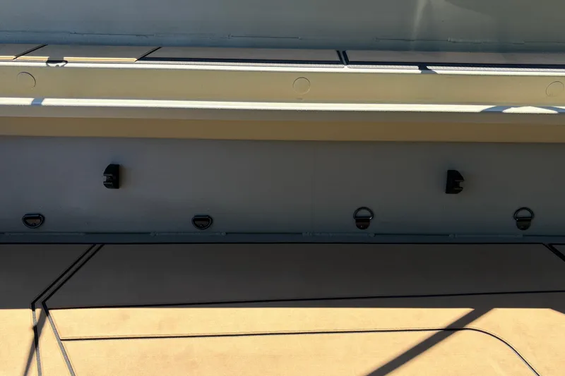 Slide: The Image of 2026 Tracker Grizzly 1756 T Marsh boat interior with hooks and storage compartments. - 7