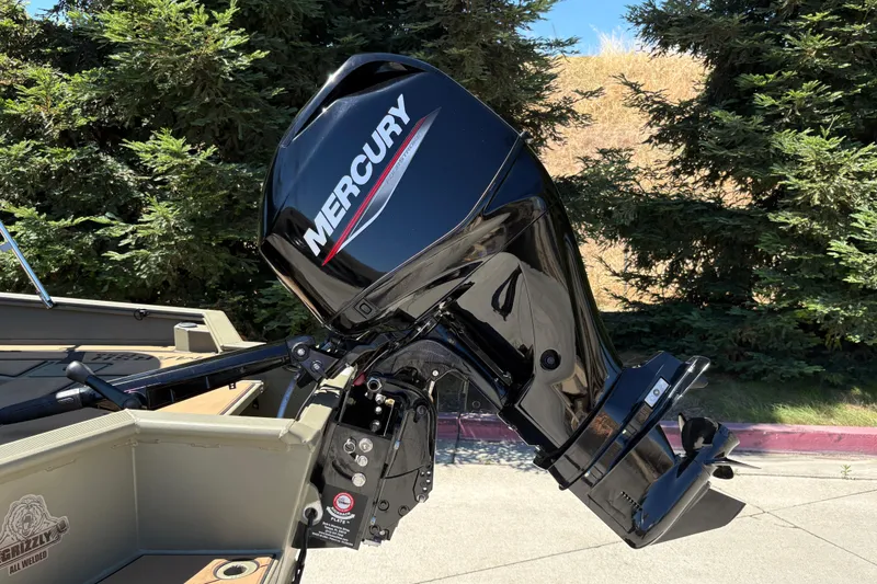 Slide: The Image of Mercury outboard motor on 2026 Tracker Grizzly 1756 T Marsh boat, outdoors. - 10
