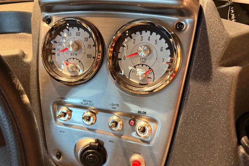 Slide: The Image of Dashboard of 2026 Tracker Pro Guide V-16 WT boat with speedometer and RPM gauges. - 49