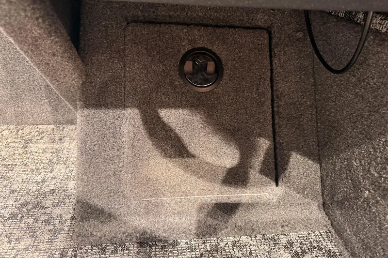 Slide: The Image of Carpeted storage compartment in 2026 Tracker Pro Guide V-16 WT boat. - 58