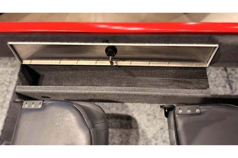 Slide: The Image of 2026 Tracker Pro Guide V-16 WT boat storage compartment with open lid and seating. - 56