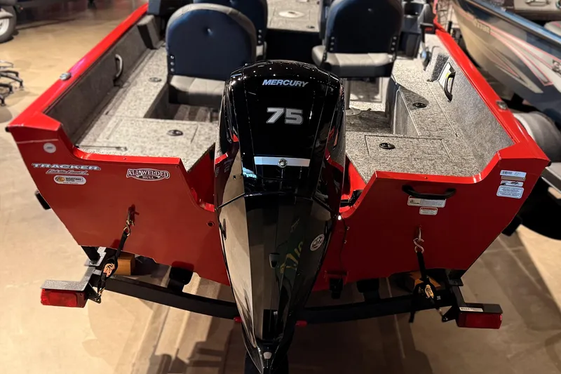 Slide: The Image of 2026 Tracker Pro Guide V-16 WT boat with Mercury 75 engine, red exterior. - 46