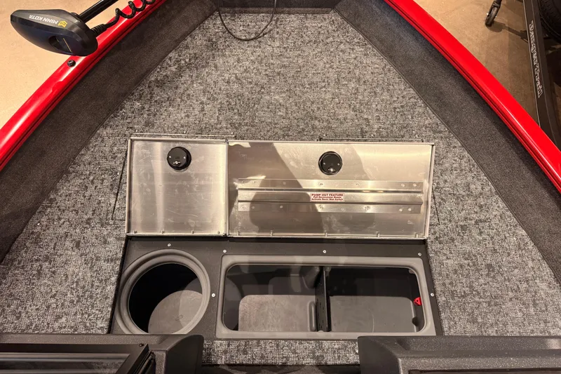 Slide: The Image of 2026 Tracker Pro Guide V-16 WT boat interior with storage compartments and carpeted flooring. - 52